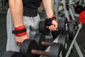 Male hands with dumbbells in gym close up Royalty Free Stock Photo