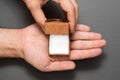 Male hands with an empty open brown jewelry box. Present. Black background Royalty Free Stock Photo