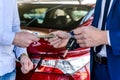 Male hands exchanging with euro and car keys Royalty Free Stock Photo