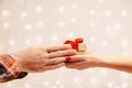 Male hands giving a gift box to woman. Royalty Free Stock Photo