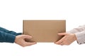 Male hands giving a package, female hands receiving a package Royalty Free Stock Photo