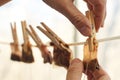 Male hands are hanging used tea bags for drying Royalty Free Stock Photo