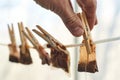 Male hands are hanging used tea bags for drying Royalty Free Stock Photo