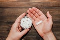 Male hands hold in hand a box of snus with nicotine spiders. Royalty Free Stock Photo