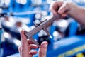 Male hands hold vernier caliper and measure steel collar. Royalty Free Stock Photo