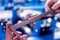 Male hands hold vernier caliper and measure steel collar. Royalty Free Stock Photo