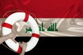 Male hands hold on a white life buoy against the background of the silk national flag of Iraq, the concept of medical insurance,
