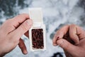 Male hands holding a bait for winter fishing. Royalty Free Stock Photo