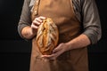 male hands holding bread. domestic cozy bakery pastry. Healthy food concept. place for text