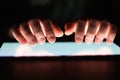 Male hands holding digital tablet at night close-up Royalty Free Stock Photo