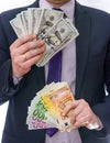 Male hands holding dollar and euro banknotes in fan Royalty Free Stock Photo