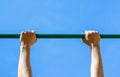 Male hands holding the horizontal bar Royalty Free Stock Photo