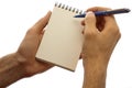 Male hands holding pad and pen isolated on a white
