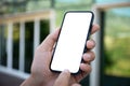 male hands holding phone with  screen background building street Royalty Free Stock Photo