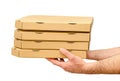 Male hands holding pizza boxes. Food order and delivering concept