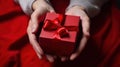 male hands holding a red gift box to a woman, female holiday gift generative ai Royalty Free Stock Photo