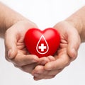 Male hands holding red heart with donor sign Royalty Free Stock Photo