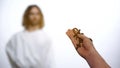 Male hands holding Rosary, praying to appeared God on background, salvation Royalty Free Stock Photo