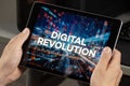a male hands holding a tablet with the phrase digital revolution over a technology concept Royalty Free Stock Photo