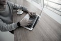 Male hands on keyboard of moderm laptop. Freelance concept. Programmer concept. Cut view of young man working on Royalty Free Stock Photo