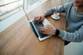 Male hands on keyboard of moderm laptop. Freelance concept. Programmer concept. Cut view of young man working on Royalty Free Stock Photo