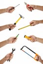 Male hands with lots of house improvement tools isolated on white Royalty Free Stock Photo