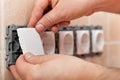 Male hands mounting electrical wall socket - closeup Royalty Free Stock Photo