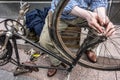 Male hands on old bicycle vintage, grunge chain detail Royalty Free Stock Photo