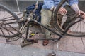 Male hands on old bicycle vintage, grunge chain detail Royalty Free Stock Photo