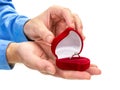 Male hands open a red velvet box containing a diamond ring. The concept of marriage proposal Royalty Free Stock Photo