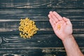 In male hands, pasta on black wooden background Royalty Free Stock Photo