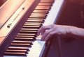 Male hands on the piano keys closeup of a beautiful colorful background Royalty Free Stock Photo