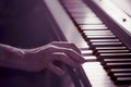 Male hands on the piano keys closeup of a beautiful colorful background Royalty Free Stock Photo