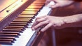 Male hands on the piano keys closeup of a beautiful colorful background Royalty Free Stock Photo