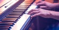 Male hands on the piano keys closeup of a beautiful colorful background Royalty Free Stock Photo