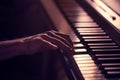 Male hands on the piano keys closeup of a beautiful colorful background Royalty Free Stock Photo