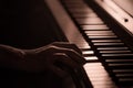 Male hands on the piano keys closeup of a beautiful colorful background Royalty Free Stock Photo