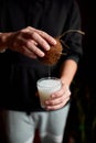 Male hands pour in glasse vegan coconut milk Royalty Free Stock Photo