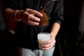 Male hands pour in glasse vegan coconut milk Royalty Free Stock Photo