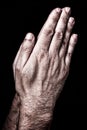 Male hands praying with palms together. Black background Royalty Free Stock Photo