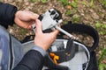 Male hands prepare a mini drone with a camera for flight