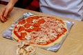 Male hands preparing dough for pizza on table closeup Royalty Free Stock Photo