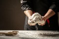 Male hands preparing dough for pizza on table closeup. Food concept Royalty Free Stock Photo