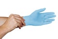 Male hands putting on blue medical gloves isolated on white background Royalty Free Stock Photo