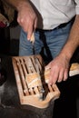 Male hands slicing bread