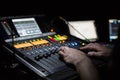 Male hands on sound mixing desk used at Dr Hook's performance at Aylesbury Waterside theatre