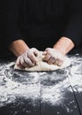 Male hands substitute white wheat flour dough