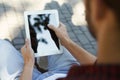 Male hands with tablet, over shoulder shot