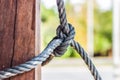 Male hands tie a rope tree,Rope knot line tied together with nature background,as a symbol for trust Royalty Free Stock Photo