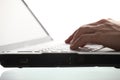 Male hands typing on laptop